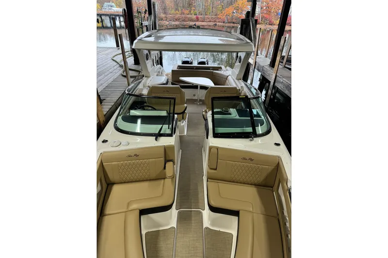  Yacht Photos Pics 2019 Sea Ray SLX 310 Outboard boat with tan seating, docked in a marina.