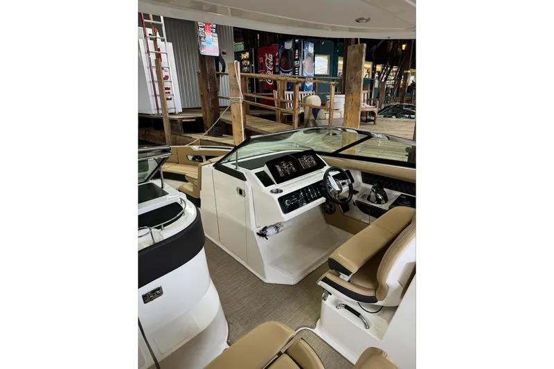  Yacht Photos Pics 2019 Sea Ray SLX 310 Outboard boat interior with modern dashboard and seating.