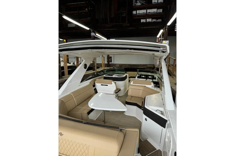  Yacht Photos Pics 2019 Sea Ray SLX 310 Outboard interior with beige seating and sleek design.