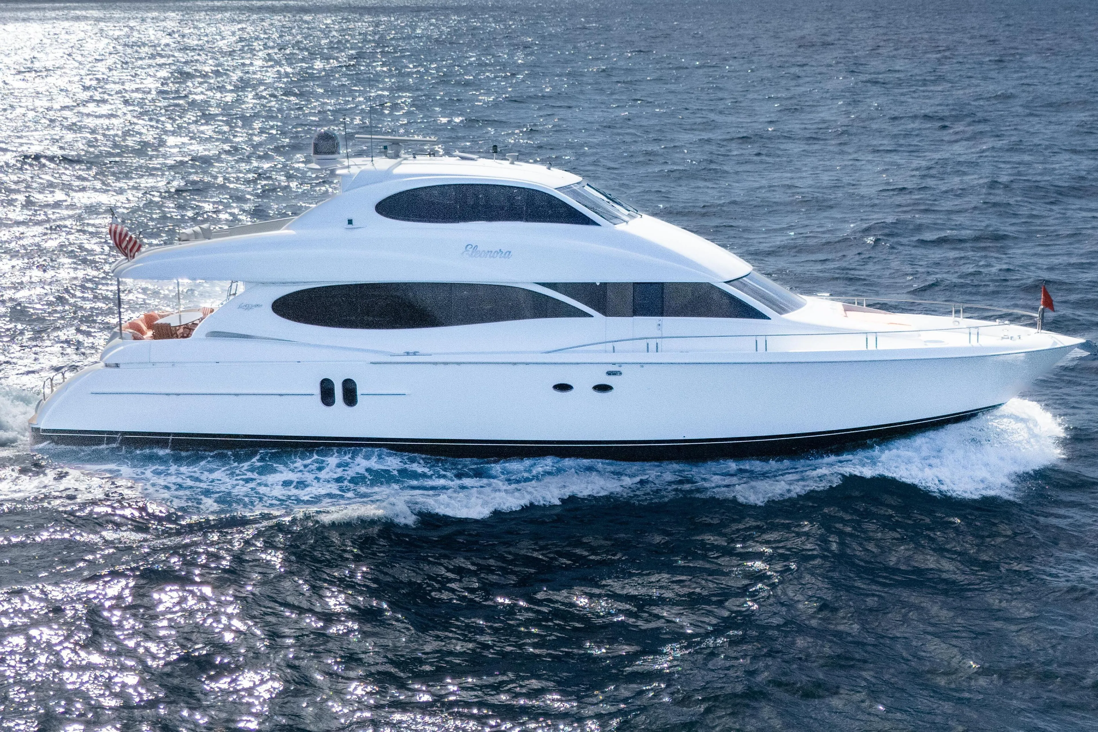 Luxury yacht Lazzara 80 SL 2004 cruising on open sea.
