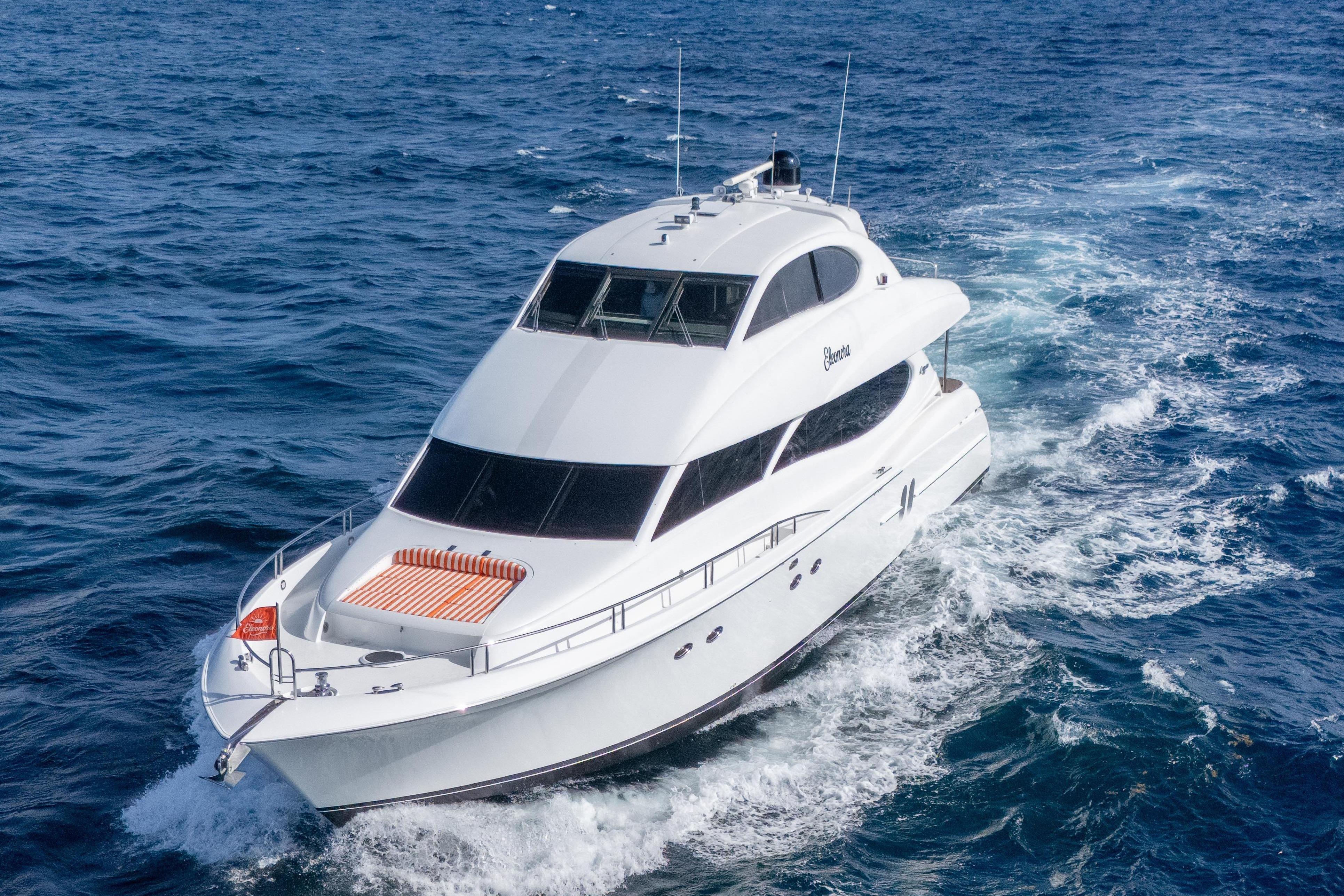 Luxury yacht Lazzara 80 SL 2004 cruising on open sea.