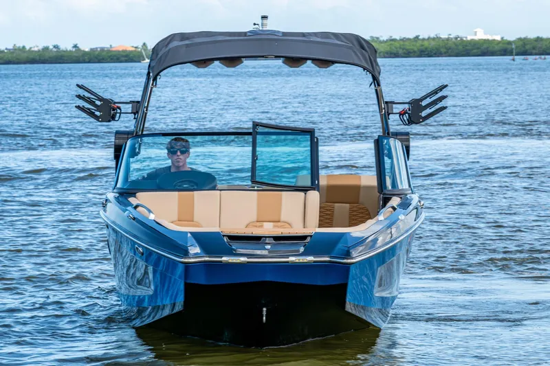  Yacht Photos Pics 2022 MasterCraft X26 boat on water, featuring sleek design and modern amenities.