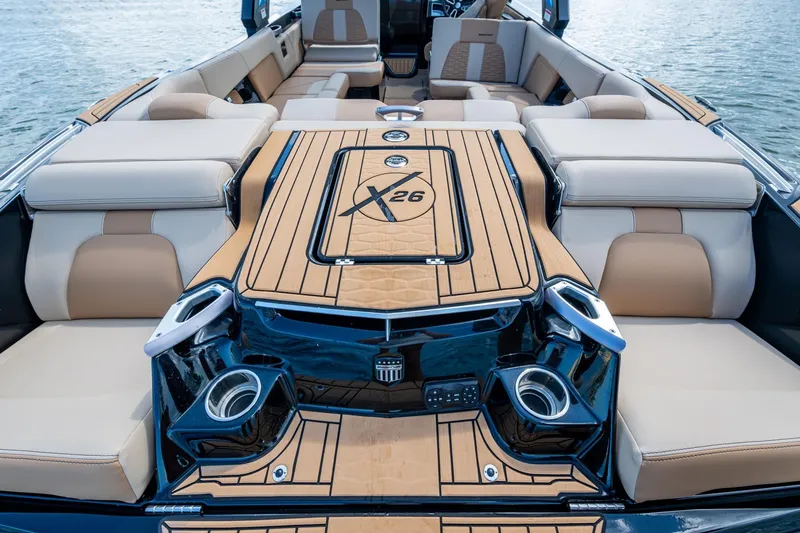  Yacht Photos Pics 2022 MasterCraft X26 boat interior with luxurious seating and stylish design on the water.