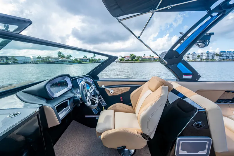  Yacht Photos Pics Interior of 2022 MasterCraft X26 boat with luxurious seating and modern dashboard.