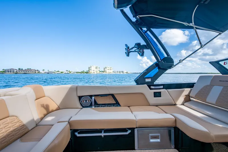  Yacht Photos Pics Luxurious interior of 2022 MasterCraft X26 boat with scenic waterfront view.