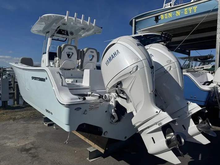  Yacht Photos Pics 2025 Sportsman Heritage 26 boat with dual Yamaha engines, docked outdoors.