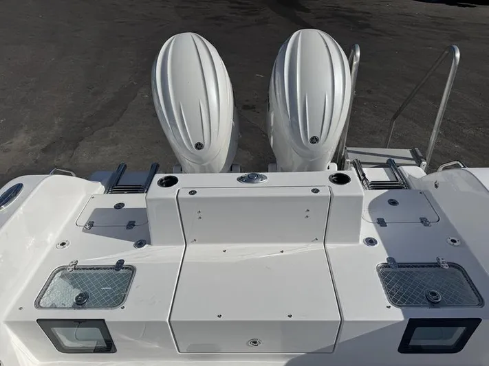  Yacht Photos Pics 2025 Sportsman Heritage 26 boat with dual outboard engines, rear deck view.