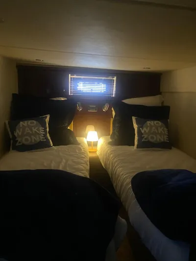 Isabela Yacht Photos Pics Cozy twin cabin in 2008 Sea Ray 48 Sundancer yacht with "No Wake Zone" pillows.