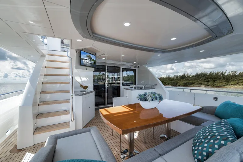 Live Mas Yacht Photos Pics Luxurious 2017 Ocean Alexander 85 E yacht deck with elegant seating and scenic views.