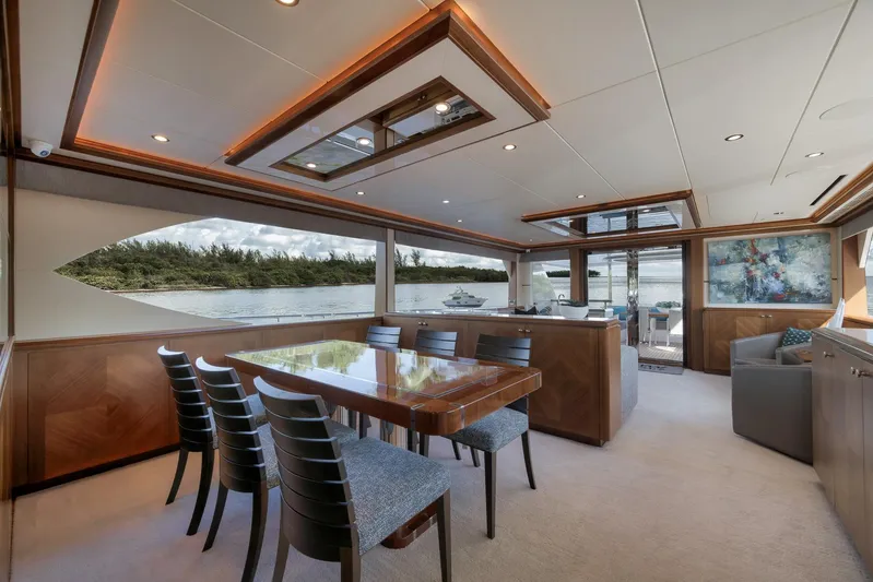 Live Mas Yacht Photos Pics Luxurious interior of 2017 Ocean Alexander 85 E yacht with elegant dining area and scenic views.