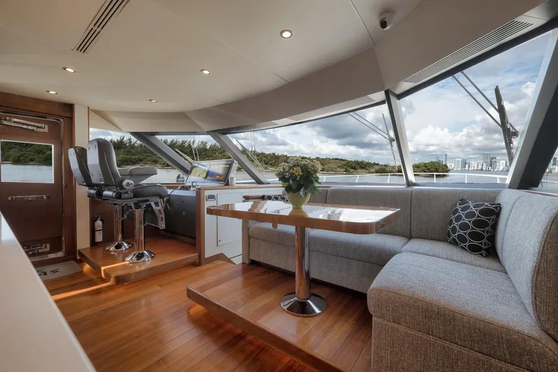 Live Mas Yacht Photos Pics Luxurious interior of 2017 Ocean Alexander 85 E yacht with panoramic windows and elegant seating.