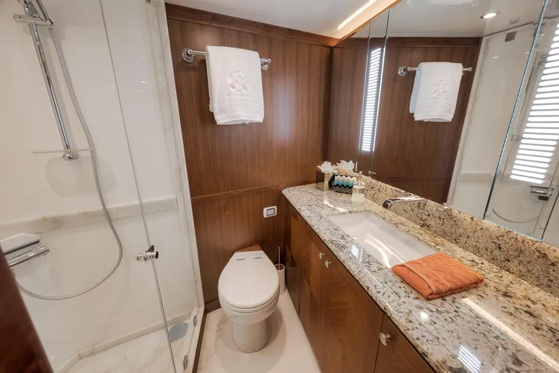 Live Mas Yacht Photos Pics Luxurious bathroom in 2017 Ocean Alexander 85 E yacht with granite countertop and glass shower.