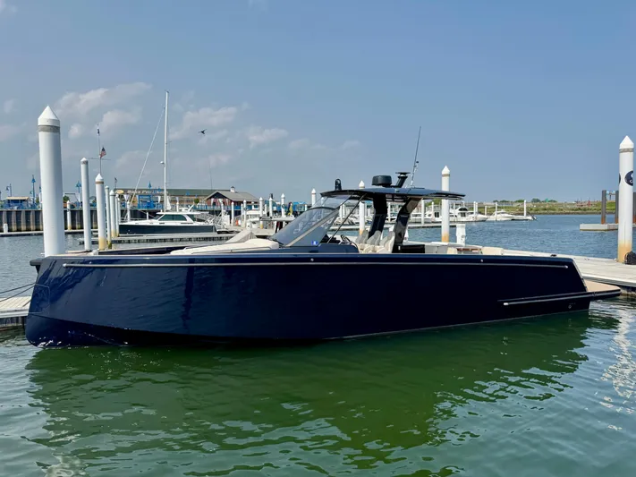  Yacht Photos Pics 2021 Pardo Yachts 43 docked at marina, sleek design, calm water, clear sky.