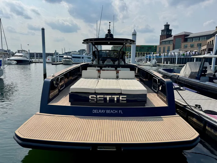  Yacht Photos Pics 2021 Pardo Yachts 43 docked at marina, featuring spacious deck and luxury seating.