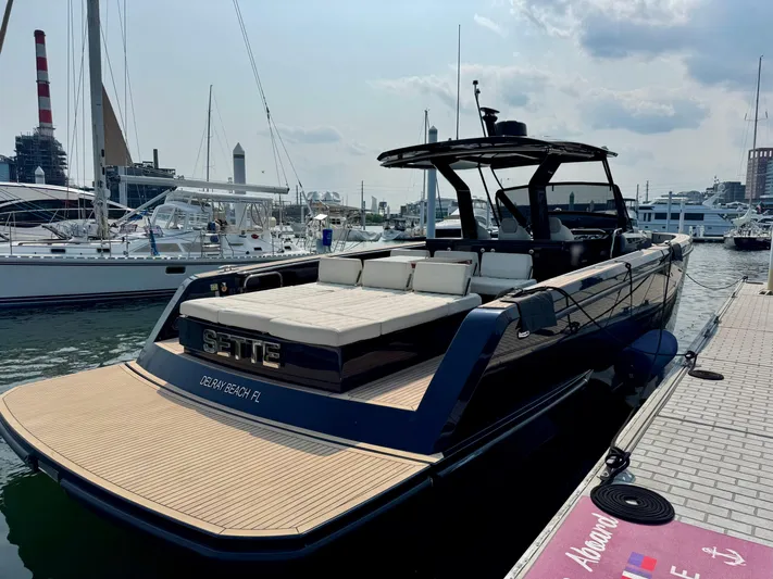  Yacht Photos Pics 2021 Pardo Yachts 43 docked at marina, featuring sleek design and spacious deck.