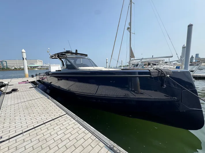  Yacht Photos Pics 2021 Pardo Yachts 43 docked at a marina under clear blue skies.