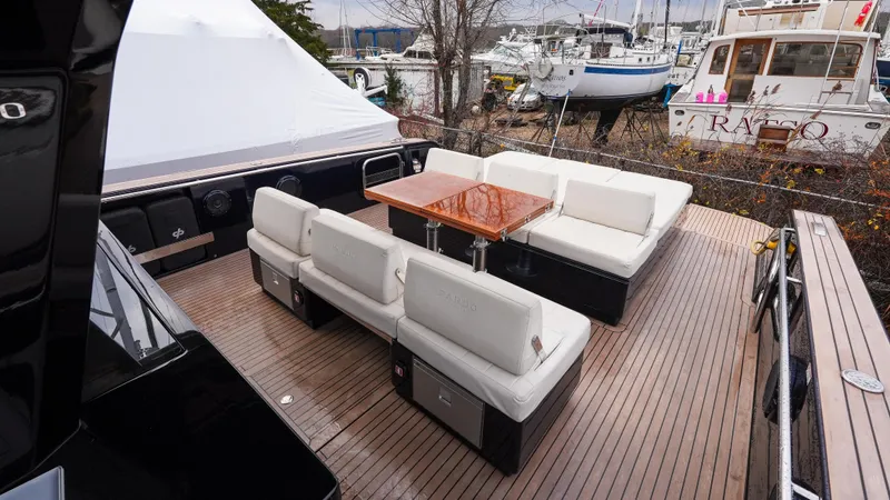  Yacht Photos Pics Luxurious 2021 Pardo Yachts P43 deck with elegant seating and wooden table.
