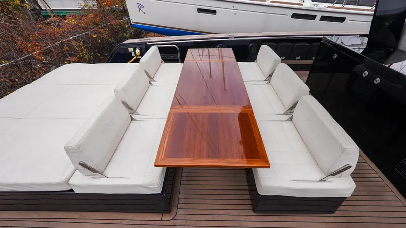  Yacht Photos Pics Luxury seating area on 2021 Pardo Yachts P43 with elegant wooden table.