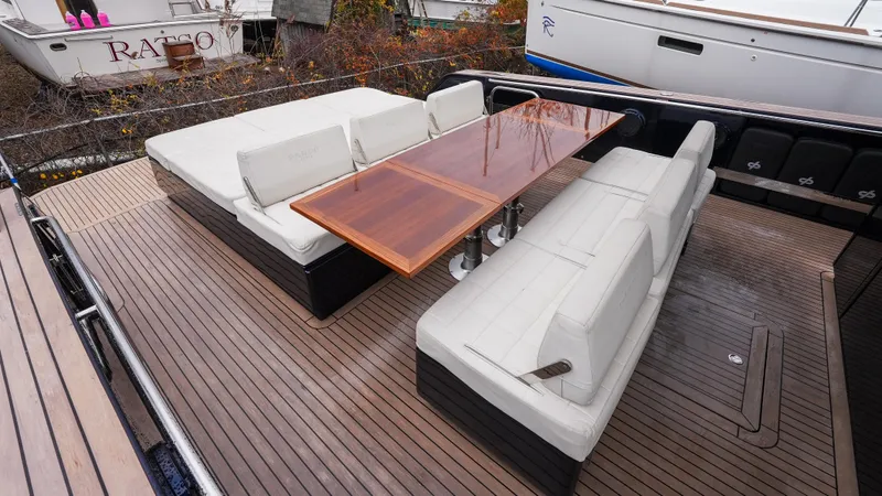  Yacht Photos Pics 2021 Pardo Yachts P43 deck with elegant seating and wooden table.