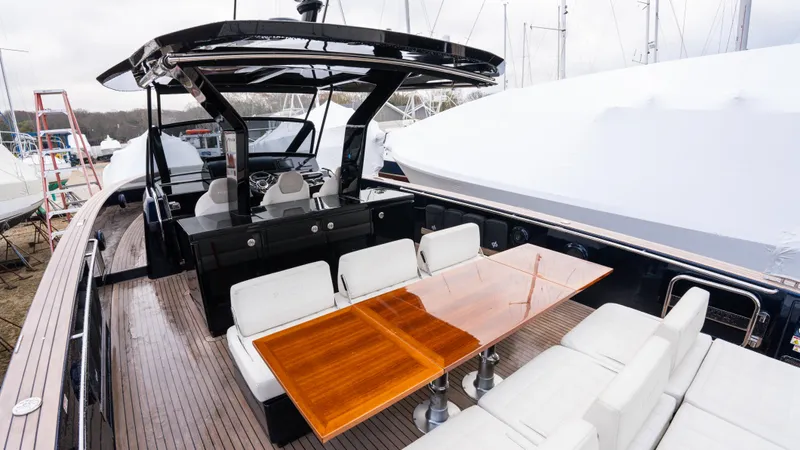  Yacht Photos Pics 2021 Pardo Yachts P43 with sleek deck, modern seating, and elegant wooden table.