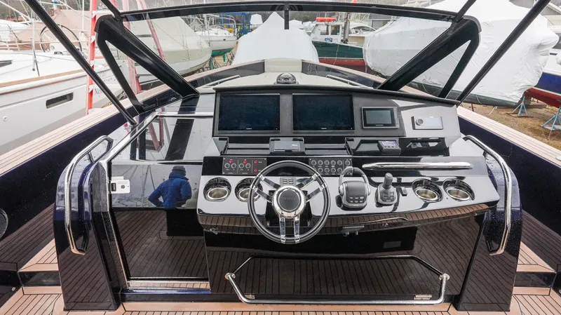  Yacht Photos Pics 2021 Pardo Yachts P43 helm with modern navigation equipment and sleek design.