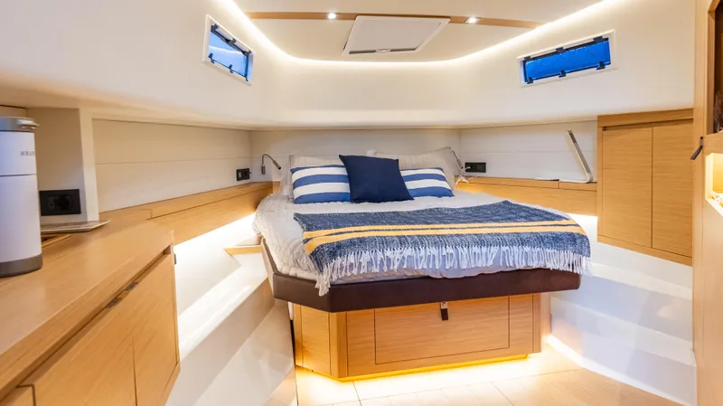  Yacht Photos Pics Luxurious cabin interior of 2021 Pardo Yachts P43, featuring a cozy bed and modern design.
