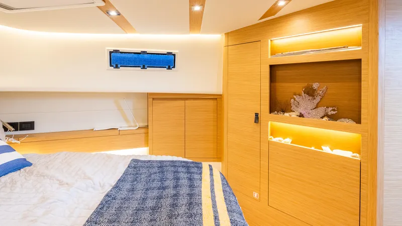  Yacht Photos Pics Luxurious interior of 2021 Pardo Yachts P43 with modern wood finish and ambient lighting.