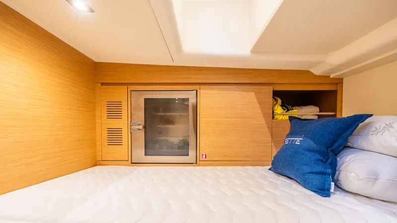 Yacht Photos Pics Interior cabin of 2021 Pardo Yachts P43, featuring a cozy bed and storage space.