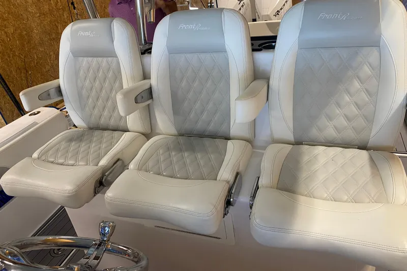 Yacht Photos Pics 2022 Front Runner 39 CC boat seats with diamond-stitched upholstery and armrests.