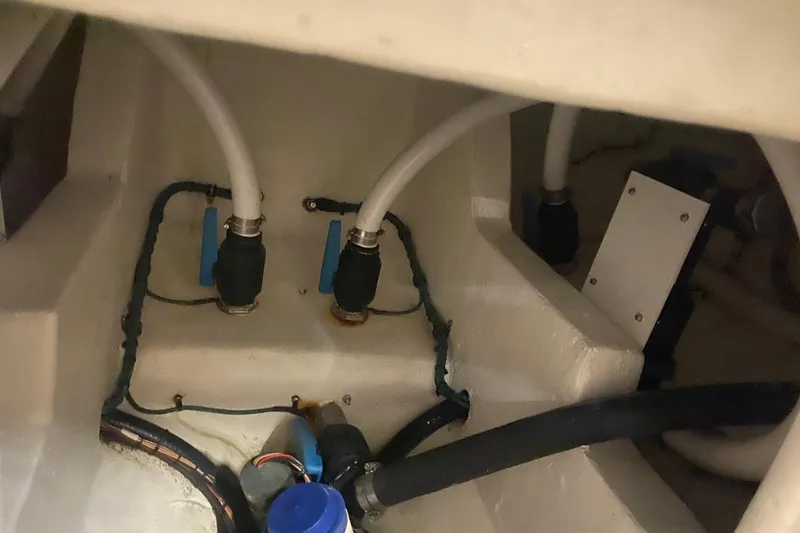  Yacht Photos Pics Engine compartment of 2022 Front Runner 39 CC boat, showing hoses and fittings.