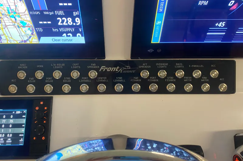  Yacht Photos Pics Control panel of a 2022 Front Runner 39 CC boat with navigation and system switches.