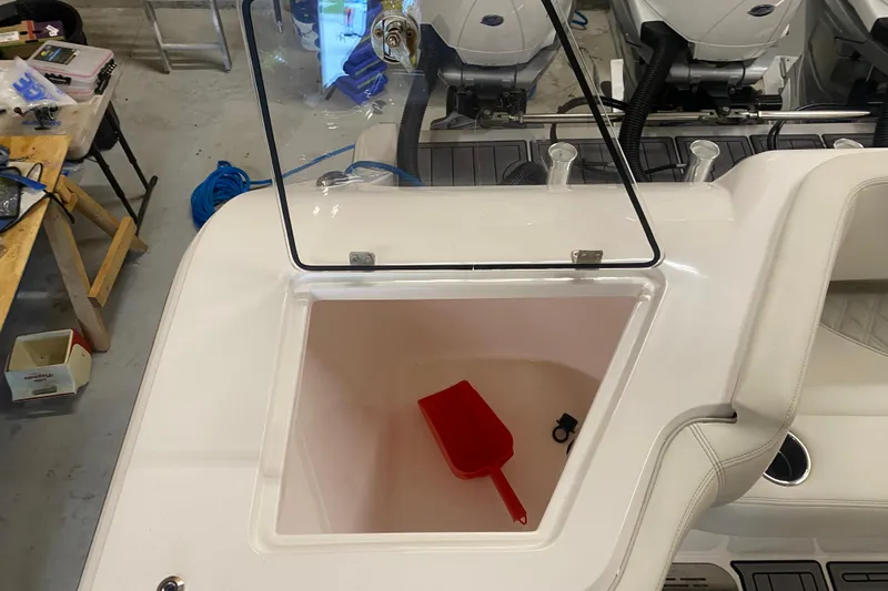  Yacht Photos Pics 2022 Front Runner 39 CC boat storage compartment with red scoop and accessories.