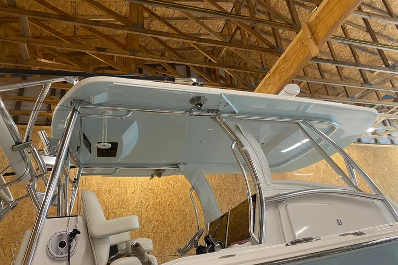  Yacht Photos Pics 2022 Front Runner 39 CC boat with sleek design in a wooden boathouse.