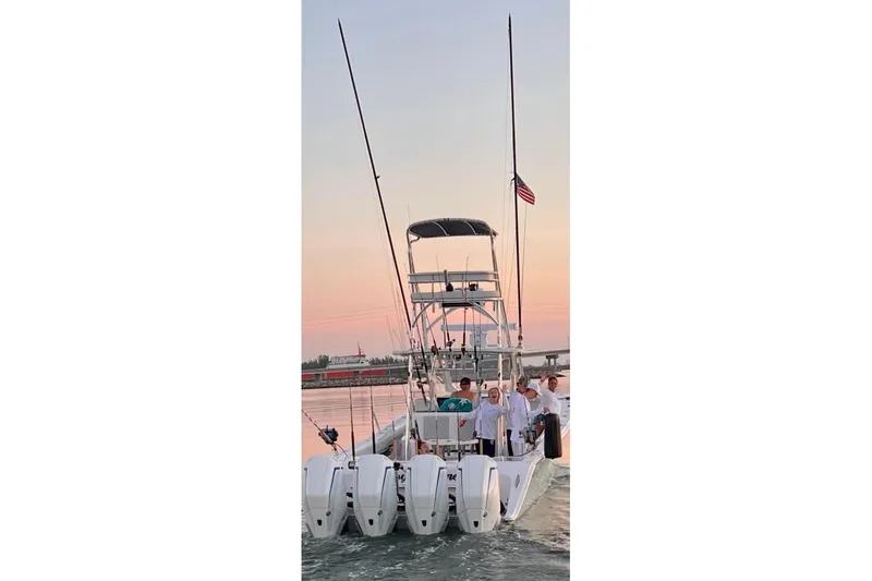  Yacht Photos Pics 2022 Front Runner 39 CC boat with multiple outboard engines at sunset.