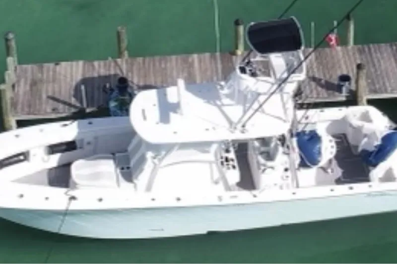  Yacht Photos Pics 2022 Front Runner 39 CC boat docked on clear water, aerial view.