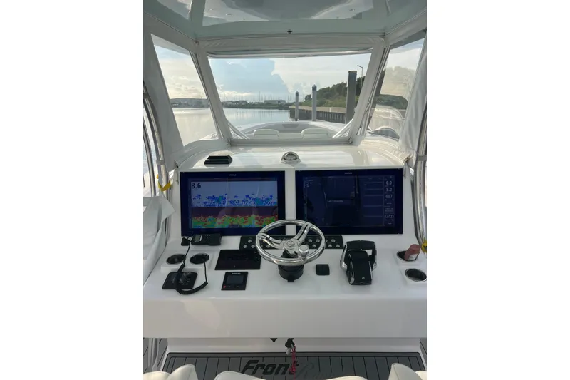  Yacht Photos Pics 2022 Front Runner 39 CC boat helm with dual screens and steering wheel.