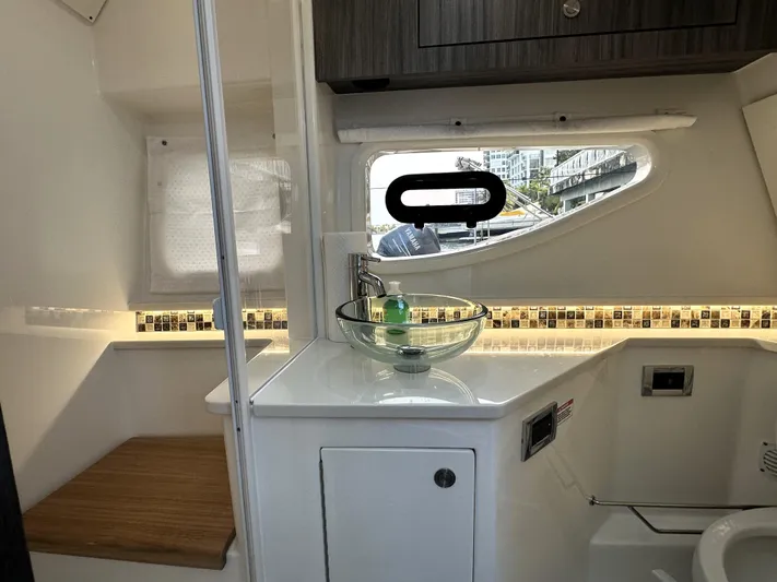 37 Sea Ray Sundancer Ob 2023 Yacht Photos Pics 2023 Sea Ray Sundancer 370 OB bathroom with modern sink and window view.