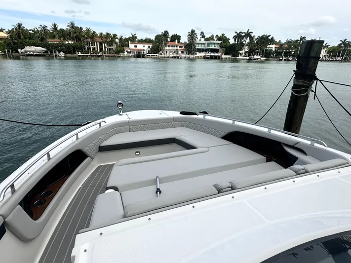 37 Sea Ray Sundancer Ob 2023 Yacht Photos Pics 2023 Sea Ray Sundancer 370 OB boat with spacious deck, docked by waterfront homes.