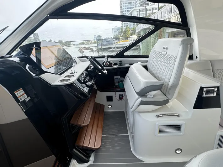 37 Sea Ray Sundancer Ob 2023 Yacht Photos Pics 2023 Sea Ray Sundancer 370 OB helm with modern controls and luxurious seating.