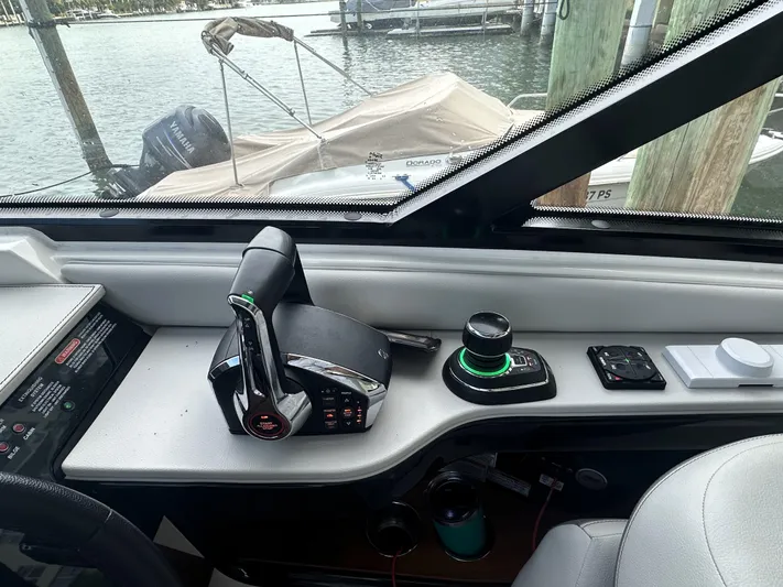 37 Sea Ray Sundancer Ob 2023 Yacht Photos Pics Control panel of 2023 Sea Ray Sundancer 370 OB boat, featuring throttle and joystick controls.