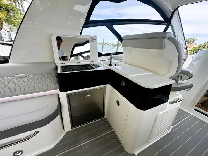 37 Sea Ray Sundancer Ob 2023 Yacht Photos Pics 2023 Sea Ray Sundancer 370 OB interior with sleek kitchenette and modern design.