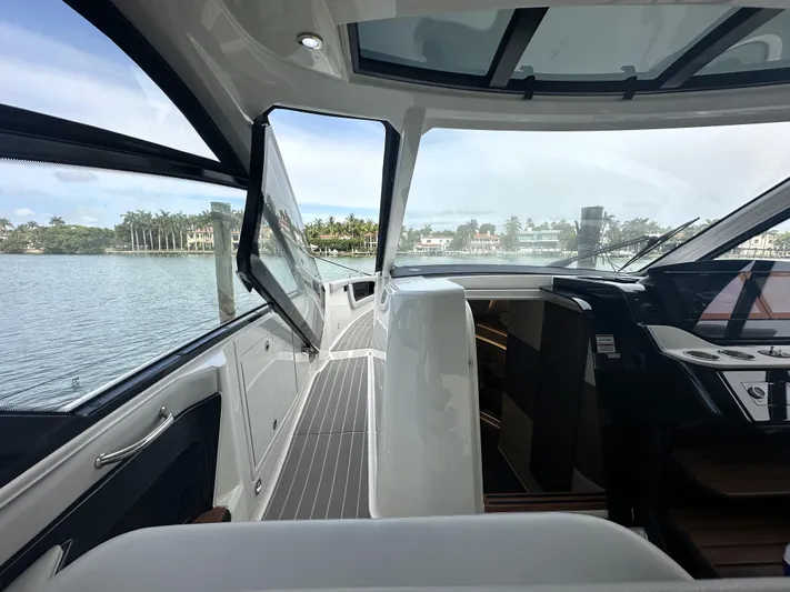 37 Sea Ray Sundancer Ob 2023 Yacht Photos Pics 2023 Sea Ray Sundancer 370 OB interior with sleek design and waterfront view.