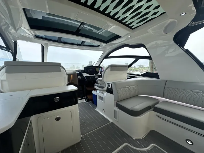 37 Sea Ray Sundancer Ob 2023 Yacht Photos Pics Interior of 2023 Sea Ray Sundancer 370 OB, featuring modern seating and sleek design.