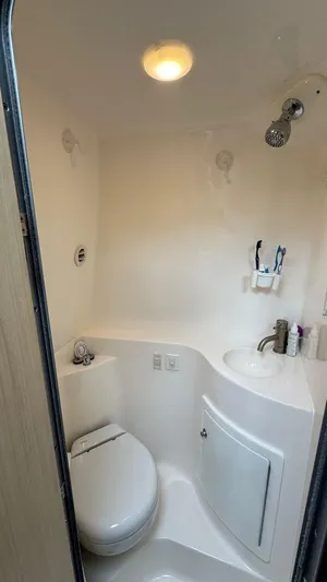  Yacht Photos Pics 2024 Regal 26 XO boat bathroom with modern fixtures and compact design.