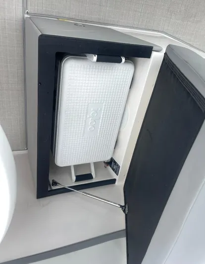  Yacht Photos Pics 2024 Regal 26 XO boat interior with built-in cooler storage compartment.