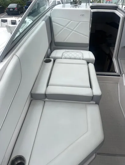  Yacht Photos Pics 2024 Regal 26 XO boat interior with luxurious seating and modern design.