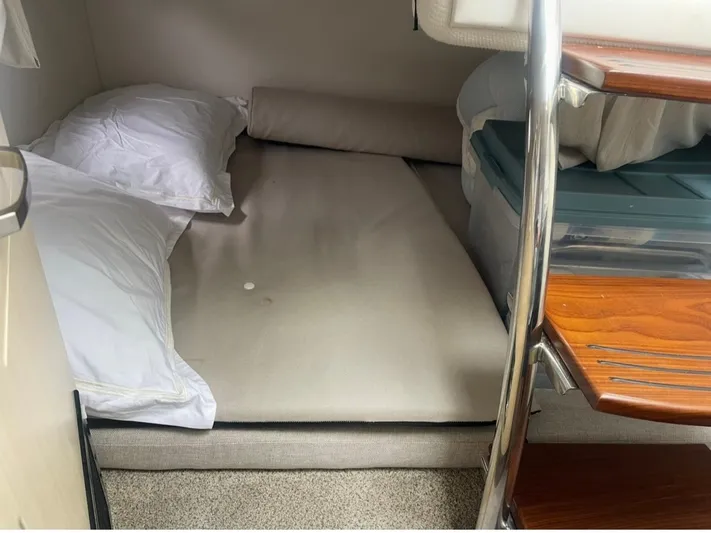  Yacht Photos Pics 2024 Regal 26 XO cabin interior with bed and wooden steps.