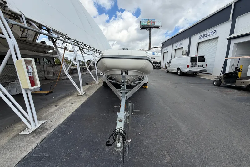  Yacht Photos Pics 2023 Williams Jet Tenders Dieseljet 625 on trailer at marina, cloudy sky.