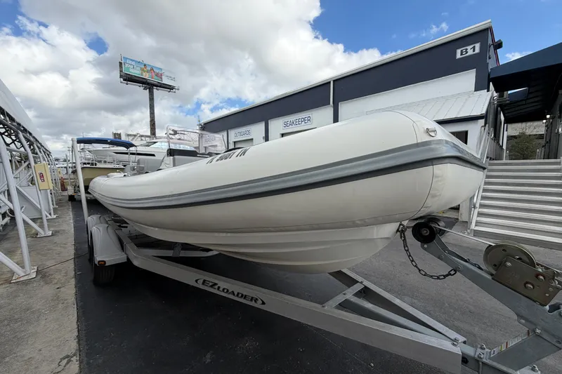  Yacht Photos Pics 2023 Williams Jet Tenders Dieseljet 625 on trailer, parked outdoors.