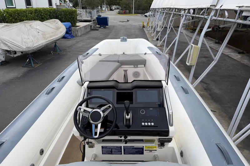  Yacht Photos Pics 2023 Williams Jet Tenders Dieseljet 625, sleek dashboard view, parked in a marina.